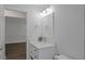 Bright bathroom with modern vanity, marble countertop, and updated light fixture at 5702 Tangerine S Ave, Gulfport, FL 33707