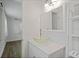 Bathroom with decorative glass bowl sink and white cabinets at 5702 Tangerine S Ave, Gulfport, FL 33707