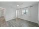 Bedroom with natural light and grey floors at 5702 Tangerine S Ave, Gulfport, FL 33707