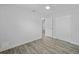 This bedroom is light and airy, with gray floors and a closet at 5702 Tangerine S Ave, Gulfport, FL 33707