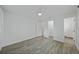 Bedroom with gray floors, white walls, and natural light at 5702 Tangerine S Ave, Gulfport, FL 33707