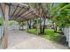 View of the house from the large carport with room for parking and gravel base at 5702 Tangerine S Ave, Gulfport, FL 33707
