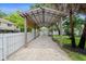Angled view of the carport, gravel base, and surrounding fence for parking and storage at 5702 Tangerine S Ave, Gulfport, FL 33707