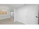 Dining area with modern light fixture, open view to kitchen and hallway at 5702 Tangerine S Ave, Gulfport, FL 33707