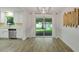 Dining area with stainless steel appliances and backyard access through sliding glass doors at 5702 Tangerine S Ave, Gulfport, FL 33707