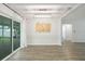 Open dining area with backyard access and modern light fixture at 5702 Tangerine S Ave, Gulfport, FL 33707