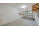 Clean garage featuring storage shelving and a garage door at 5702 Tangerine S Ave, Gulfport, FL 33707