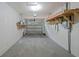 Clean garage featuring storage shelving and a garage door at 5702 Tangerine S Ave, Gulfport, FL 33707