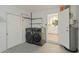 Spacious laundry area with new front-loading washer and dryer units and plenty of room at 5702 Tangerine S Ave, Gulfport, FL 33707