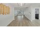 Open-concept design, featuring modern floors, a front window, and stylish light fixtures throughout at 5702 Tangerine S Ave, Gulfport, FL 33707