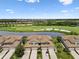 Gorgeous aerial shot of the home, golf course, and pond highlighting the desirable location and neighborhood at 5916 Wake Forest Run # 101, Bradenton, FL 34211
