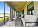 Relaxing outdoor space with a comfortable lounge area and scenic golf course views providing a peaceful retreat at 5916 Wake Forest Run # 101, Bradenton, FL 34211