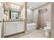 Bathroom with bathtub, neutral walls, white cabinets and tile floors at 5916 Wake Forest Run # 101, Bradenton, FL 34211