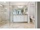 Bathroom with large glass shower, neutral gray walls, white cabinets and tile floors at 5916 Wake Forest Run # 101, Bradenton, FL 34211