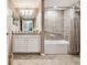 Bathroom with bathtub, neutral walls, white cabinets and tile floors at 5916 Wake Forest Run # 101, Bradenton, FL 34211