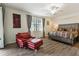 Bedroom with an accent chair and large windows at 5916 Wake Forest Run # 101, Bradenton, FL 34211