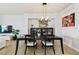 Elegant dining room with modern chandelier and stylish decor at 5916 Wake Forest Run # 101, Bradenton, FL 34211