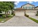Beautiful two-story home with a three-car garage and stone accents on the facade at 5916 Wake Forest Run # 101, Bradenton, FL 34211