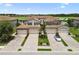 Beautiful home exterior showcasing the attached garage, lush landscaping, and manicured lawn in a great neighborhood at 5916 Wake Forest Run # 101, Bradenton, FL 34211