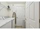Laundry room featuring a washing machine, dryer, and storage shelves at 5916 Wake Forest Run # 101, Bradenton, FL 34211