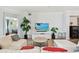 Comfortable living room with modern decor, tile flooring, and a view of the house at 5916 Wake Forest Run # 101, Bradenton, FL 34211