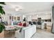 Bright and spacious living room open to the kitchen and with tiled floors at 5916 Wake Forest Run # 101, Bradenton, FL 34211