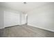 Spacious bedroom with light gray flooring, a large closet, and fresh paint at 609 Carmel Rd, Venice, FL 34293