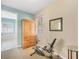 Bedroom area adjacent to the bathroom featuring natural light and neutral tones at 6312 41St E Ct, Sarasota, FL 34243