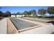 Bocce ball courts featuring shaded seating and well-maintained landscaping in a recreational area at 6312 41St E Ct, Sarasota, FL 34243