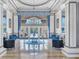Elegant clubhouse entrance with a chandelier, high ceilings, and comfortable seating at 6312 41St E Ct, Sarasota, FL 34243