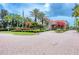 Community center showcasing beautiful landscaping, well-maintained grounds, and mature trees at 6312 41St E Ct, Sarasota, FL 34243