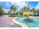 Stunning water fountain with lush landscaping, creating a serene atmosphere in the community at 6312 41St E Ct, Sarasota, FL 34243