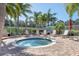 Community hot tub surrounded by comfortable lounge chairs and privacy fence at 6312 41St E Ct, Sarasota, FL 34243