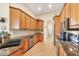 Spacious kitchen with stainless appliances, granite countertops and ample wood cabinet storage at 6312 41St E Ct, Sarasota, FL 34243