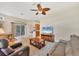 Cozy living room area with sliding glass doors to screened in patio at 6312 41St E Ct, Sarasota, FL 34243