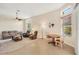 Bright living room offers tile flooring, a ceiling fan, and an adjacent dining area at 6312 41St E Ct, Sarasota, FL 34243