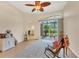 Bright living room with tile floors, ceiling fan and glass sliding door to backyard at 6312 41St E Ct, Sarasota, FL 34243