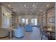 Well-appointed lounge area with comfortable seating, bookshelves, and stylish decor at 6312 41St E Ct, Sarasota, FL 34243