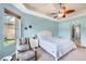 Comfortable primary bedroom with a ceiling fan and a peaceful atmosphere at 6312 41St E Ct, Sarasota, FL 34243