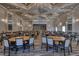 Spacious meeting room with a stage, elegant chandeliers, and ample seating for large gatherings at 6312 41St E Ct, Sarasota, FL 34243