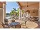 Outdoor patio with ceiling fans and tables with close proximity to pool area at 6312 41St E Ct, Sarasota, FL 34243
