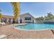 Charming poolside building with a swim-up bar, overlooking the sparkling pool and sun loungers at 6312 41St E Ct, Sarasota, FL 34243