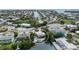 Aerial view highlighting a home with a pool and boat dock nestled among canals at 6806 Palm Dr, Holmes Beach, FL 34217