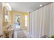 Bathroom featuring large shower, vanity, and natural lighting to create a spa-like experience at 6806 Palm Dr, Holmes Beach, FL 34217