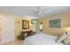 Cozy bedroom featuring a double bed, desk, and sunny yellow walls for a cheerful ambiance at 6806 Palm Dr, Holmes Beach, FL 34217