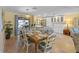 Bright dining room and kitchen area with a large dining table and seating for eight at 6806 Palm Dr, Holmes Beach, FL 34217