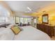 Spacious main bedroom with a large bed, bay window, and dresser at 6806 Palm Dr, Holmes Beach, FL 34217