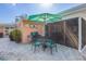 A shaded outdoor dining area with a grill is perfect for entertaining guests at 6806 Palm Dr, Holmes Beach, FL 34217
