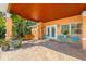 Covered patio with a tile floor and a seating area offers a serene outdoor space at 6806 Palm Dr, Holmes Beach, FL 34217