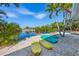 Beautiful waterfront view with kayaks, beach, and tropical palm trees creates a peaceful paradise at 6806 Palm Dr, Holmes Beach, FL 34217